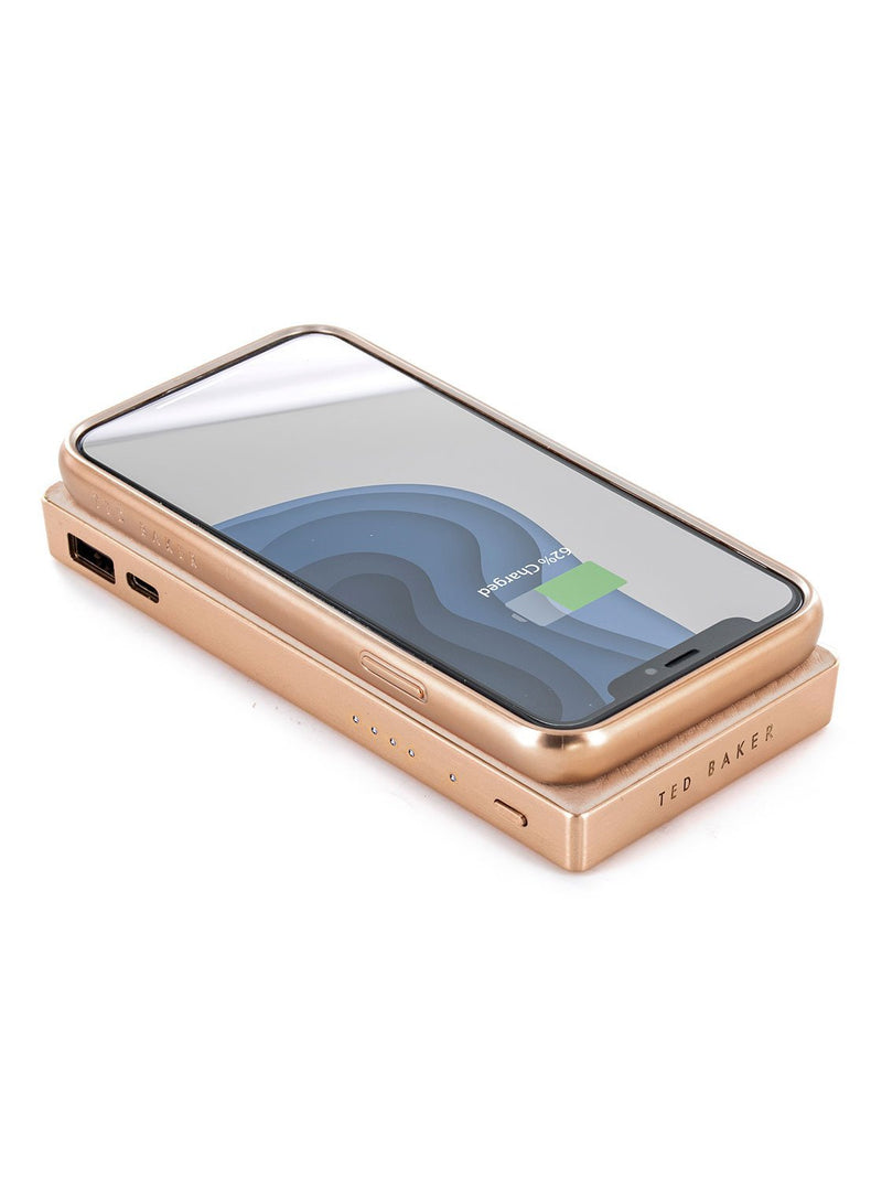 With compatible device image of the Ted Baker Universal wireless charger in Taupe